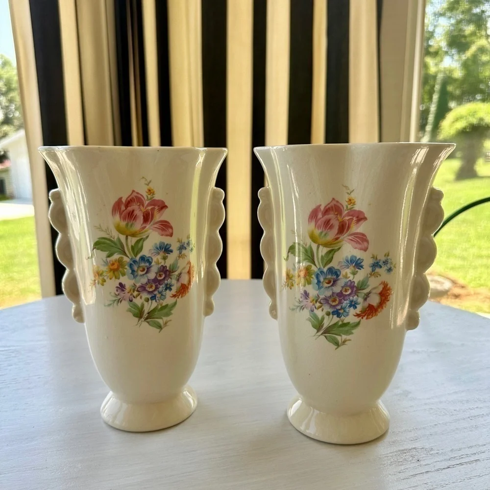 1950’S SET/2 , FLORAL VASES. SOFT CREAM COLOR WITH ONE SIDED FLORAL DESIGN.